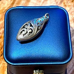 Sterling Silver Scrollwork pendant.